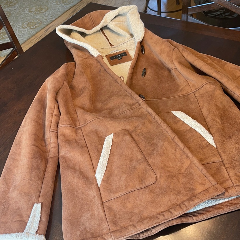 Brown coat with fur inside.